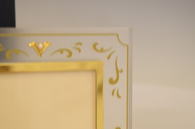 Lot 255 - Mikimoto International plastic and pearl mounted photograph frame