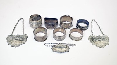 Lot 165 - Elizabeth II silver decanter label, six napkin rings, etc