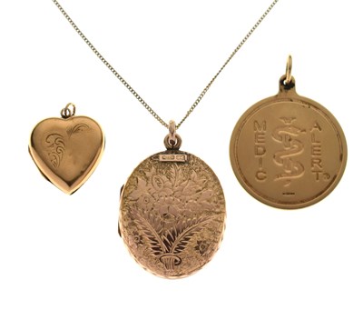 Lot 69 - Large oval yellow metal locket (stamped 9c), a 9ct gold medic alert pendant, etc