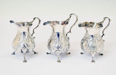 Lot 171 - Three Georgian silver cream jugs