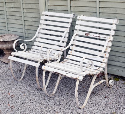 Lot 554 - Pair of white painted wooden slatted garden chairs