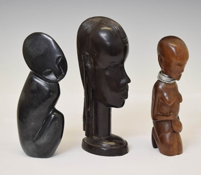 Lot 288 - Zimbabwean soapstone figure in knee-to-chest pose, signed F. Kamombe
