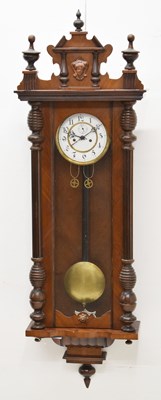 Lot 502 - Early 20th century walnut-cased twin weight Vienna wall clock