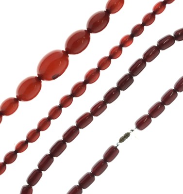 Lot 130 - Three strings of 1920s Bakelite amber beads