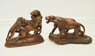 Lot 252 - Two hardwood carved sculptures of lions