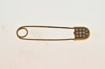 Lot 104 - Diamond set safety pin brooch