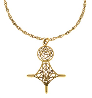 Lot 86 - Agadez or Southern Cross yellow metal pendant necklace