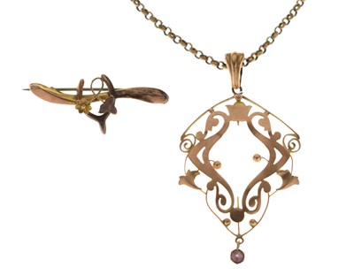 Lot 126 - Edwardian Art Nouveau style yellow metal pendant and a wishbone brooch