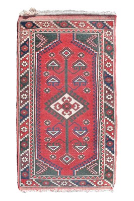 Lot 518 - Middle Eastern handmade red ground wool rug