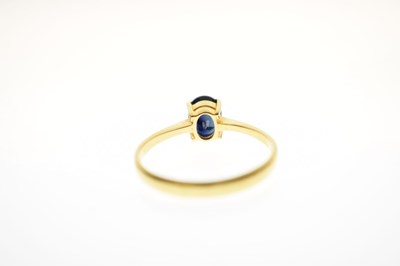 Lot 20 - Yellow metal ring set dark blue stone, stamped '14K'