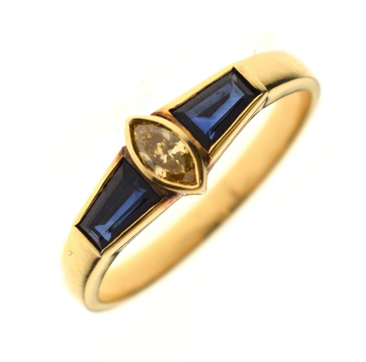 Lot 21 - Fancy cut diamond and sapphire three-stone yellow metal ring