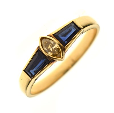 Lot 21 - Fancy cut diamond and sapphire three-stone yellow metal ring