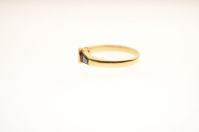 Lot 21 - Fancy cut diamond and sapphire three-stone yellow metal ring