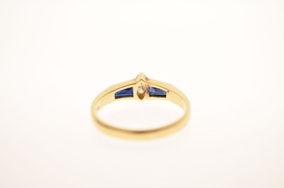 Lot 21 - Fancy cut diamond and sapphire three-stone yellow metal ring