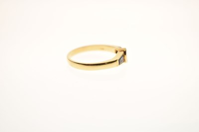 Lot 21 - Fancy cut diamond and sapphire three-stone yellow metal ring