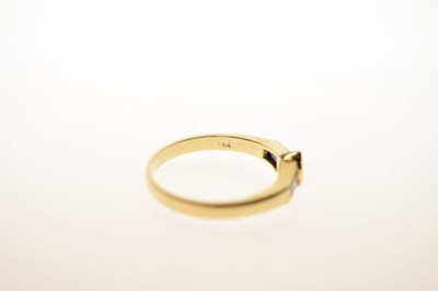 Lot 21 - Fancy cut diamond and sapphire three-stone yellow metal ring