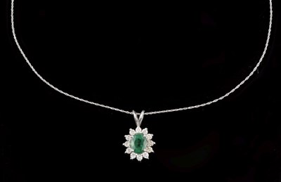 Lot 57 - Emerald and diamond cluster pendant