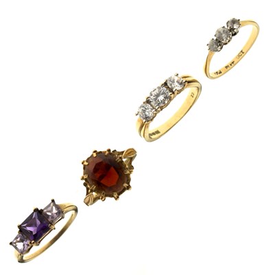 Lot 41 - Four gem-set 9ct yellow gold rings (4)