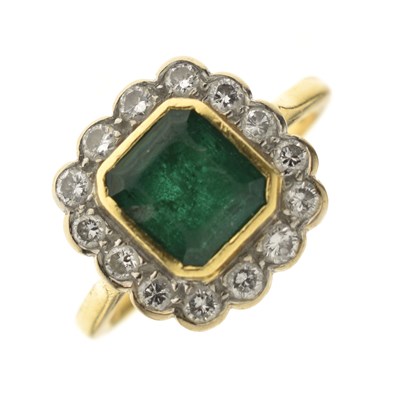 Lot 21 - Emerald and diamond 18ct yellow and white gold set cluster ring