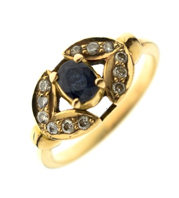 Lot 16 - Sapphire and diamond yellow metal ring