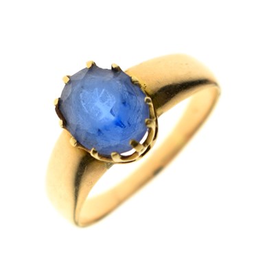 Lot 28 - Yellow metal ring set an oval blue paste-type stone, stamped 18ct