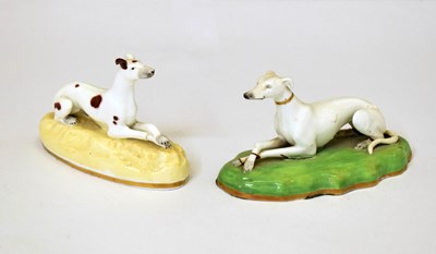 Lot 380 - Two 19th century porcelain figures of recumbent greyhounds
