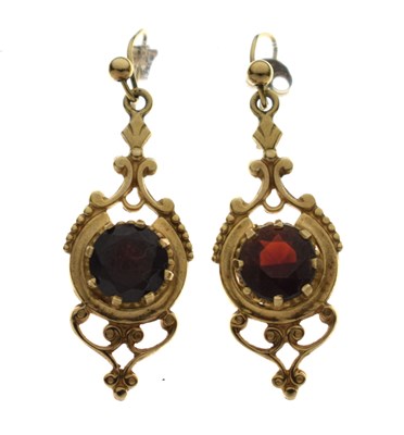 Lot 116 - Pair of antique-style 9ct gold drop earrings, each set a faceted round garnet