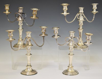 Lot 315 - Two pairs of 20th century electroplated twin-branch, three-light candelabra