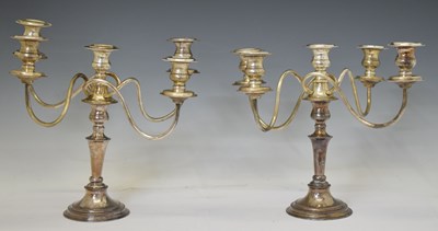 Lot 313 - Pair of 20th century electroplated four-branch, five-light candelabra