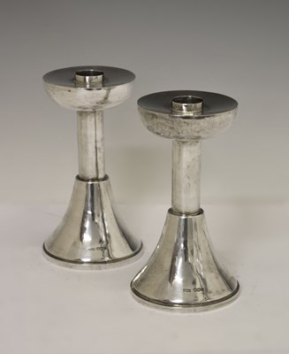 Lot Pair of Elizabeth II Arts & Crafts style silver candlesticks