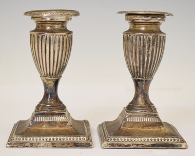 Lot 221 - Pair of late Victorian low silver candlesticks