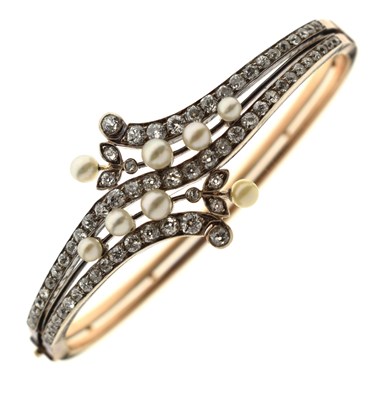 Lot 34 - Late 19th / early 20th century diamond and pearl hinged bangle