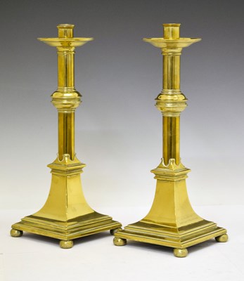 Lot Pair of brass candlesticks, with dedication inscription