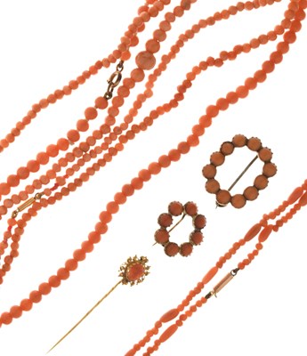 Lot 108 - Four coral bead necklaces, two brooches, and a stick pin