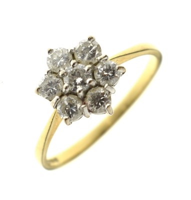 Lot 7 - Diamond seven-stone 'daisy' cluster 18ct gold ring