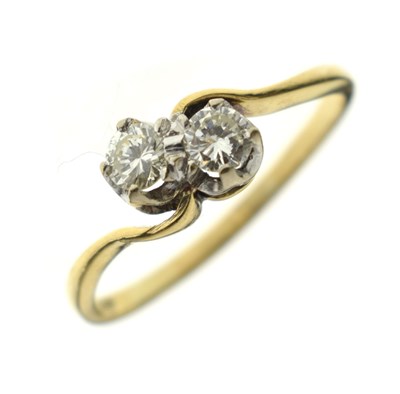 Lot 8 - Diamond two-stone crossover 18ct gold ring