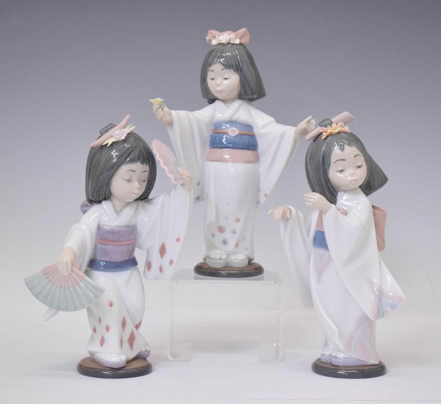 Lot 334 - Lladro - Three porcelain figures