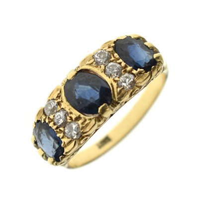 Lot 16 - Sapphire and diamond boat head yellow metal ring