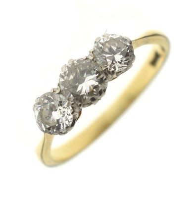 Lot 10 - 18ct gold and three stone diamond ring