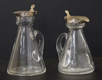 Lot 162 - Two silver mounted cut glass whisky noggins