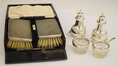 Lot 143 - Pair of silver pepperettes, pair of silver mounted salts, and a pair of silver backed brushes