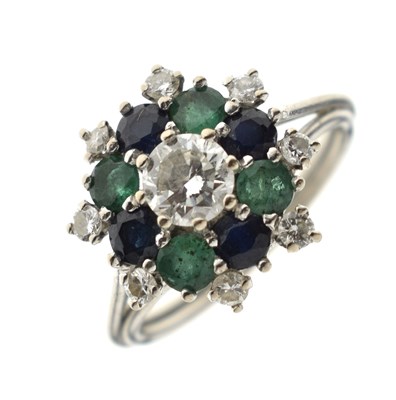 Lot 17 - Diamond, sapphire and emerald unmarked white metal cluster ring