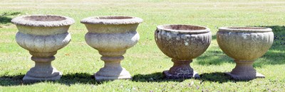 Lot 553 - Two pairs of composition stone garden urns / planters
