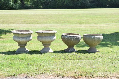 Lot 553 - Two pairs of composition stone garden urns / planters