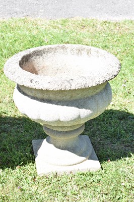 Lot 553 - Two pairs of composition stone garden urns / planters