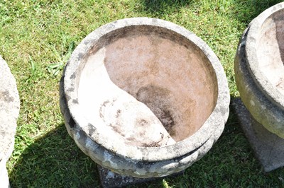 Lot 553 - Two pairs of composition stone garden urns / planters