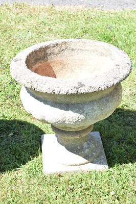 Lot 553 - Two pairs of composition stone garden urns / planters