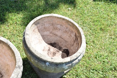 Lot 553 - Two pairs of composition stone garden urns / planters