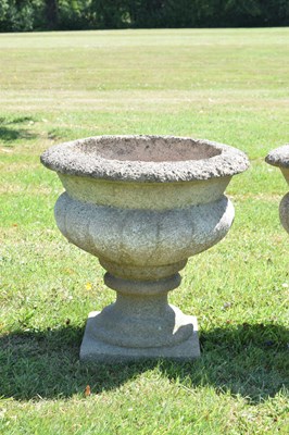 Lot 553 - Two pairs of composition stone garden urns / planters