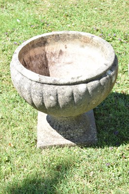 Lot 553 - Two pairs of composition stone garden urns / planters